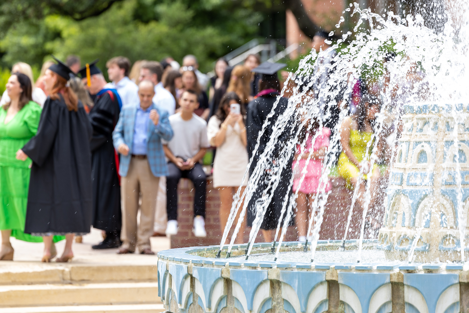 Students and families around miller fountain for commencement