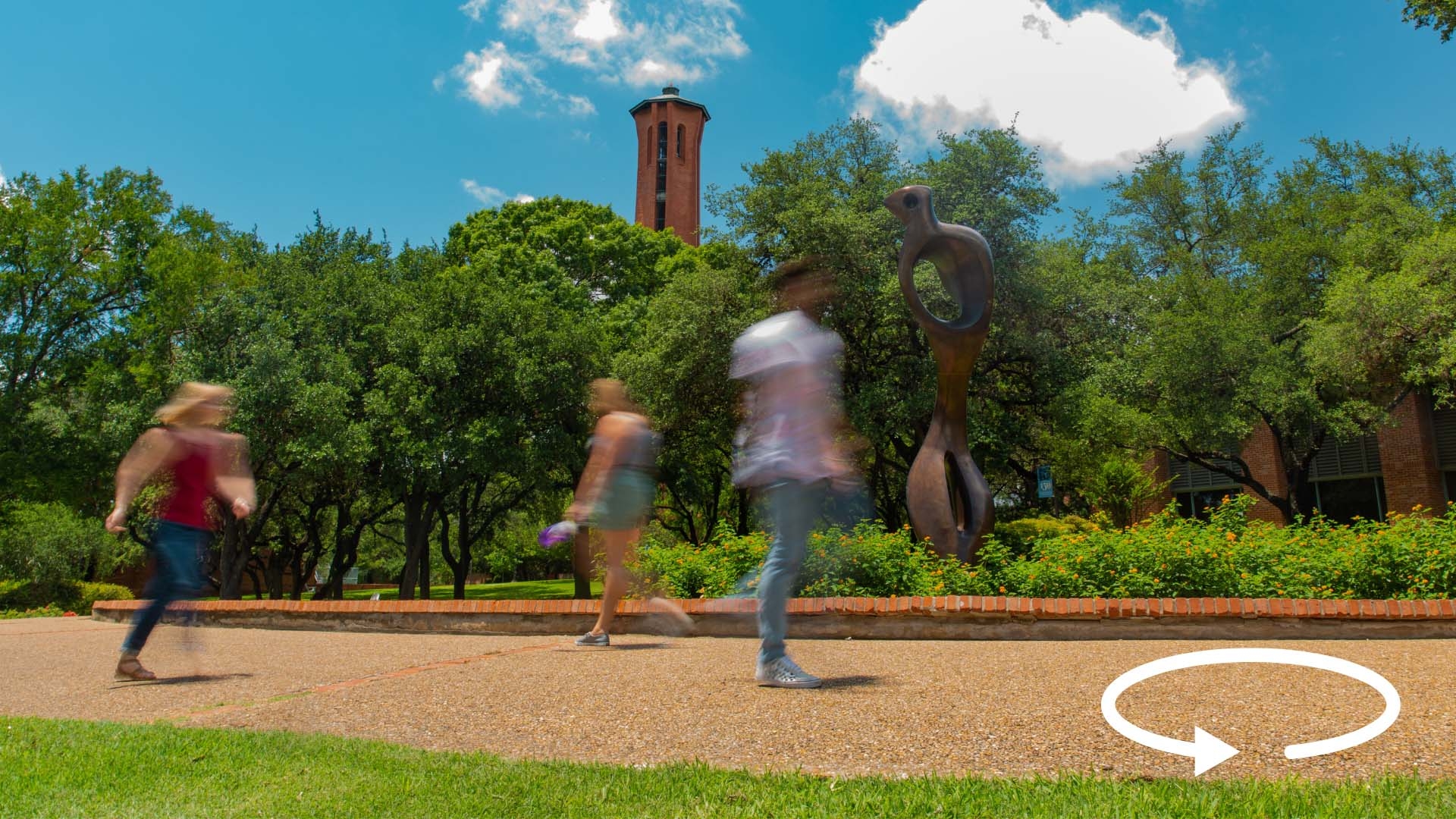 photo of students walking on a sidewalk