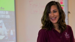Teacher in a Trinity shirt in a classroom