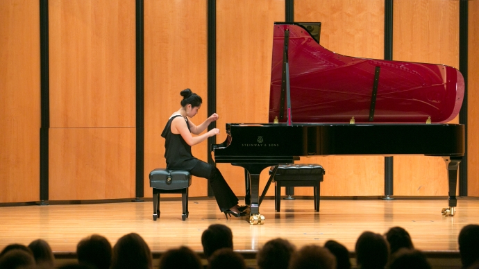 Kristina Cheng plays a maroon inlaid Steinway in the Ruth Taylor Recital Hall