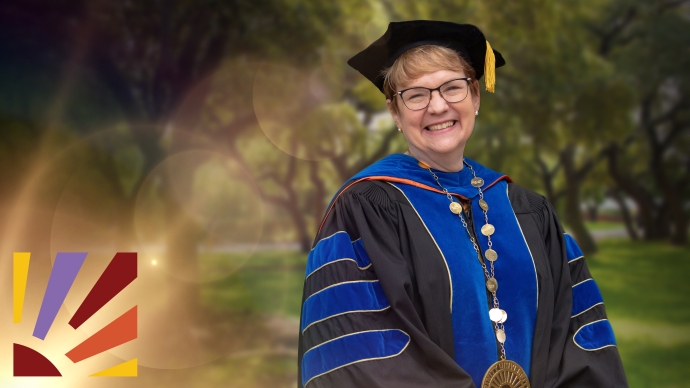 President Vanessa B. Beasley in her full regalia smiles outside