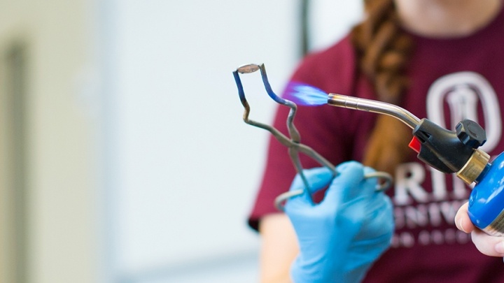 Trinity biochemistry student working in a lab