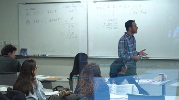 Professor teaches to a full classroom