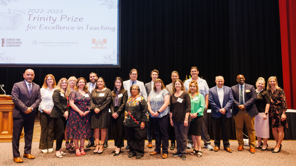The recipients of the 2023 Trinity Prize pose for a photo on the stage in Laurie Auditorium