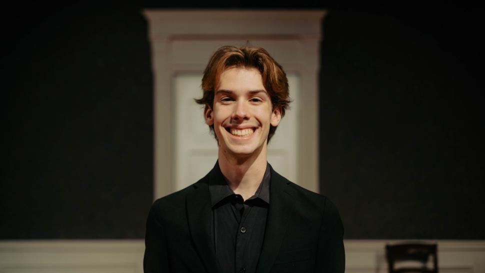 a portrait of Andrew Phillips Smiling