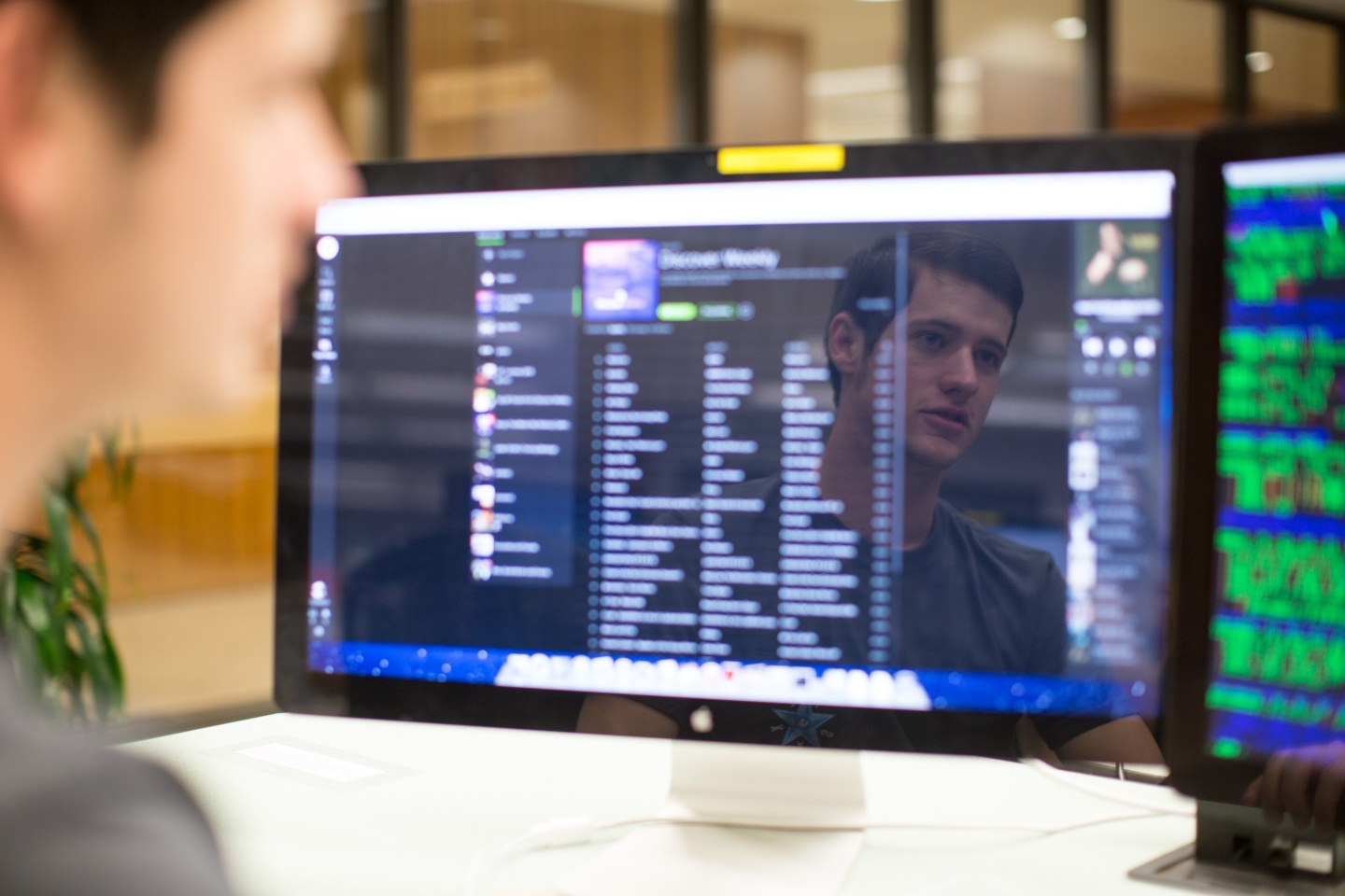 Student looking at computer code. 