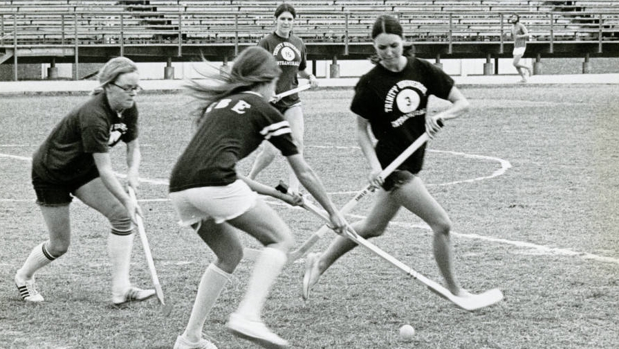Trinity women play field hockey circa 1980