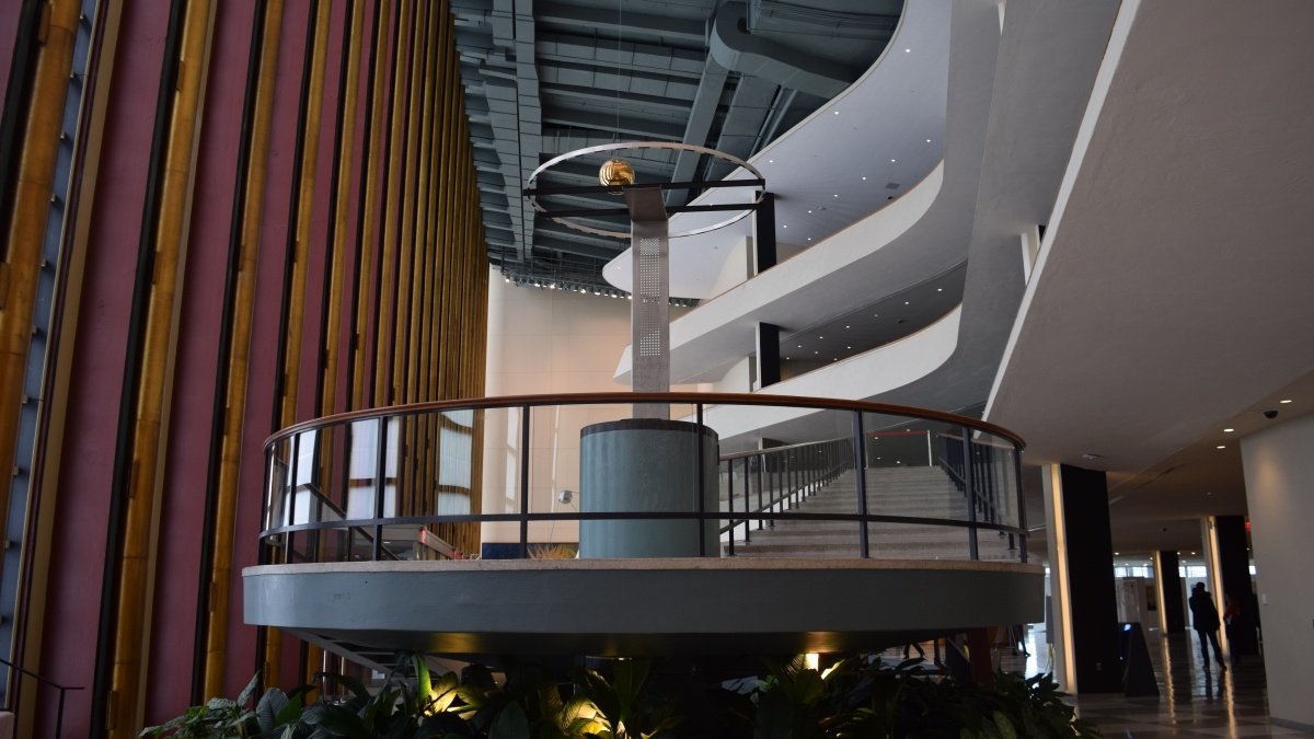 a large modern grand staircase with glass