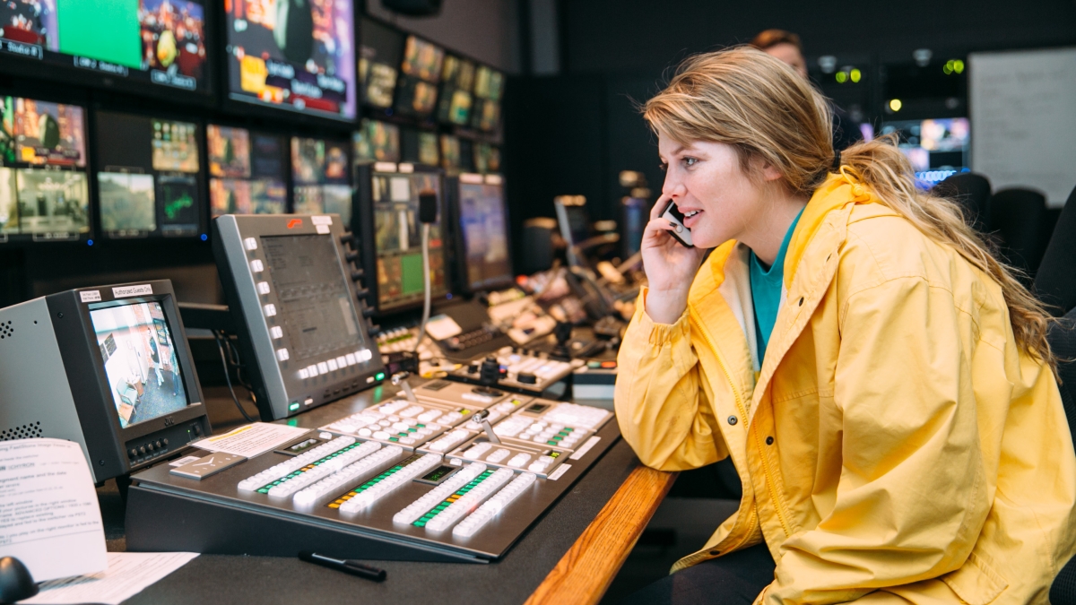 Student sitting at the television media station.