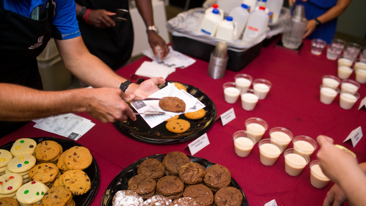 Cookies and milk are served to Trinity students at Student Involvement event.