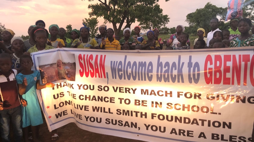people in africa with sign for susan naylor