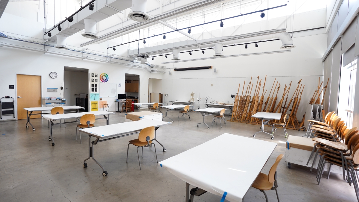 Drawing studio equipped with tables, chairs and easels. 