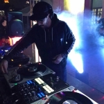 JJ Lopez spinning vinyl as a DJ